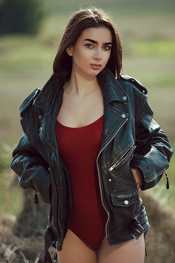 Clothing, Leather, Leather jacket, Jacket, Beauty, Lady, Thigh, Model, Long hair