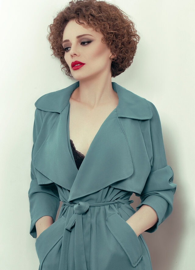 Clothing, Lip, Coat, Fashion model, Turquoise, Beauty, Hairstyle, Outerwear